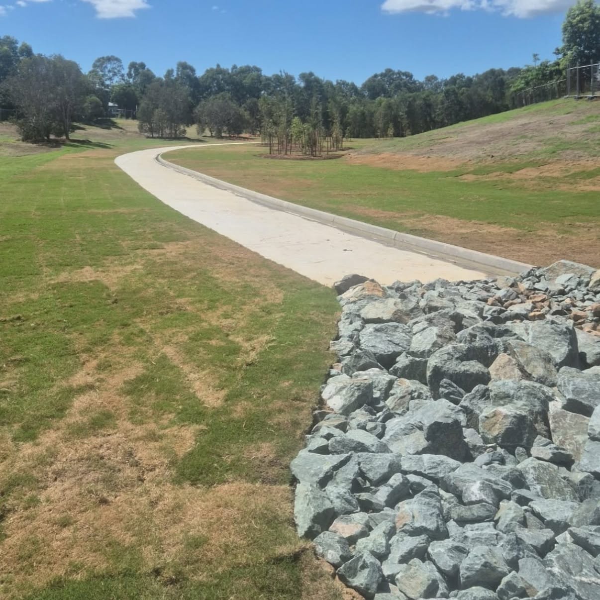 Rock retaining wall and road