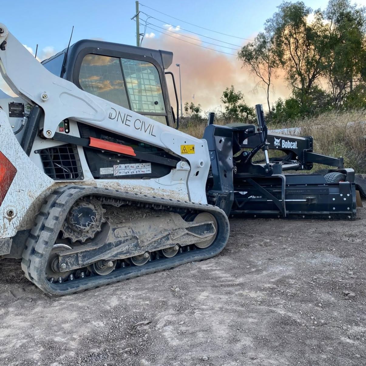 Skid steer with attachment